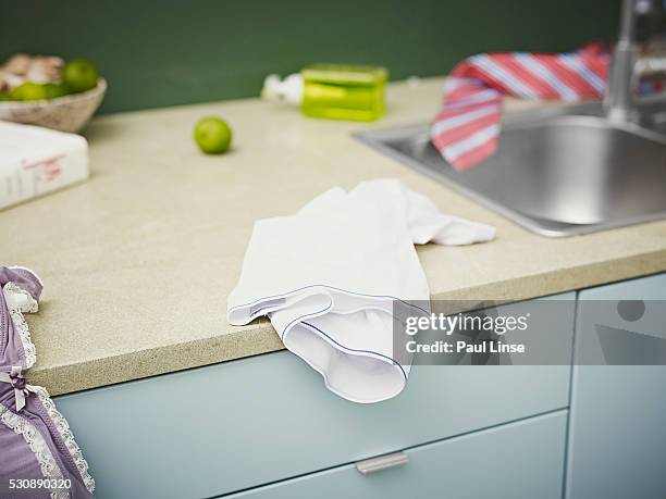 panties on a kitchen counter - dish towel stock pictures, royalty-free photos & images