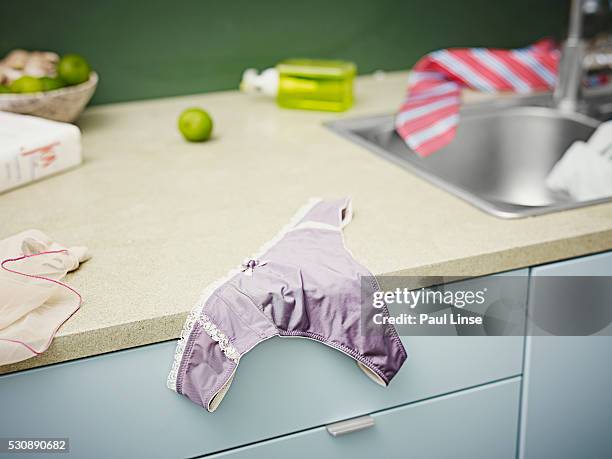 panties on a kitchen counter - linse photos et images de collection