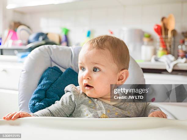 girl 1-2 years, kitchen, sitting in high chair - high chair stock pictures, royalty-free photos & images