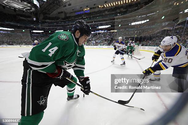 Jamie Benn of the Dallas Stars skates the puck against Alexander Steen of the St. Louis Blues in the third period in Game Seven of the Western...