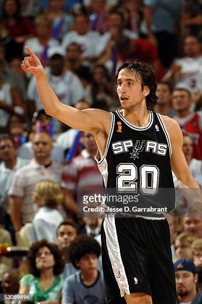 Manu Ginobili of the San Antonio Spurs points during a game against the Detroit Pistons in Game four of the 2005 NBA Finals on June 16, 2005 at the...