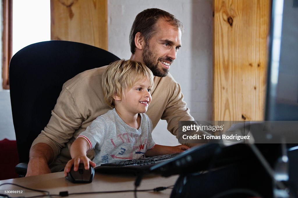 Computer Boom Dad Father And Son Using Computer High-Res Stock Photo - Getty Images