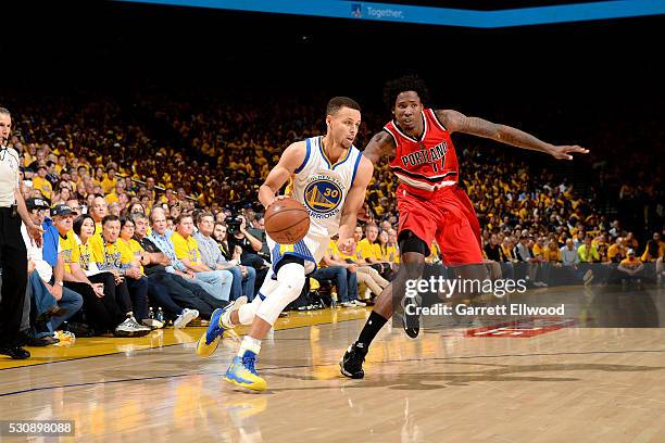 Stephen Curry of the Golden State Warriors drives to the basket during the game against Ed Davis of the Portland Trail Blazers in Game Five of the...