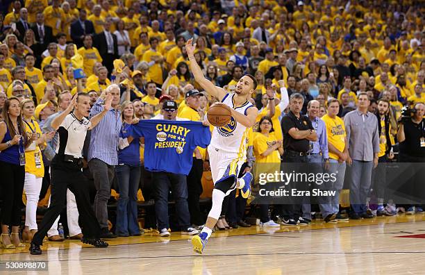 Stephen Curry of the Golden State Warriors runs down court during the finals seconds of their win over the Portland Trail Blazers in Game Five of the...