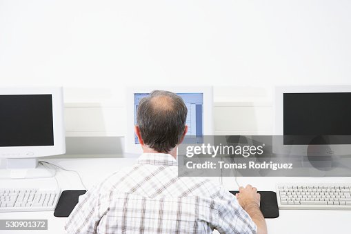 Man using a computer Man using a computer