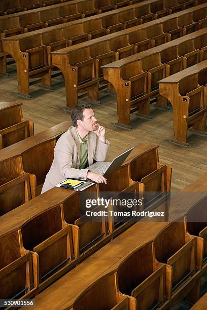 older college student paying attention - vintage classroom stock-fotos und bilder