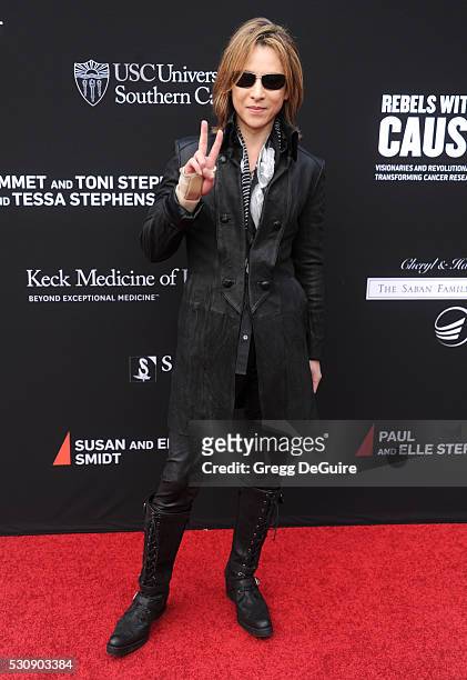 Musician Yoshiki arrives at the 3rd Biennial Rebels With A Cause Fundraiser at Barker Hangar on May 11, 2016 in Santa Monica, California.