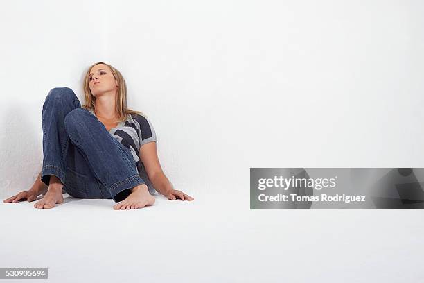 woman with pensive expression - woman collapsing stock pictures, royalty-free photos & images