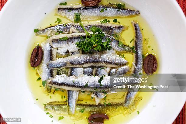 Traditional tapas - Boquerones en Vinagre con Aceitunas Kalamata at Taberna Del Alabardero photographed in Washington, DC. .