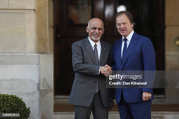 Foreign Office Minister Hugo Swire greets the President of Afghanistan, Ashraf Ghani, at Lancaster House for the international anti-corruption summit...