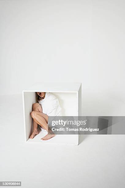 woman in box - vulnerability stock-fotos und bilder