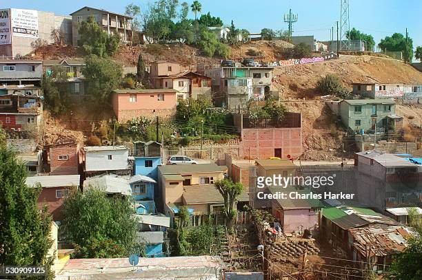 favela style housing in tijuana, mexico - mexico slums stock pictures, royalty-free photos & images