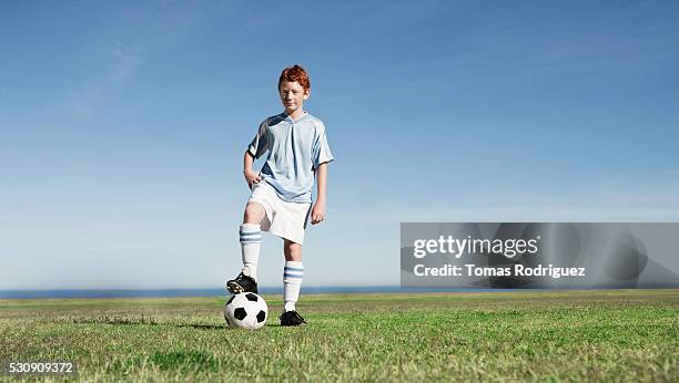 determined soccer player - boys soccer stock pictures, royalty-free photos & images