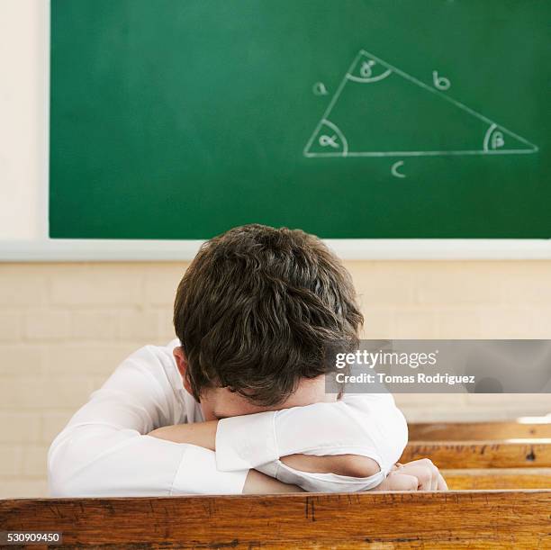 student sleeping in geometry class - one teenage boy only fotografías e imágenes de stock