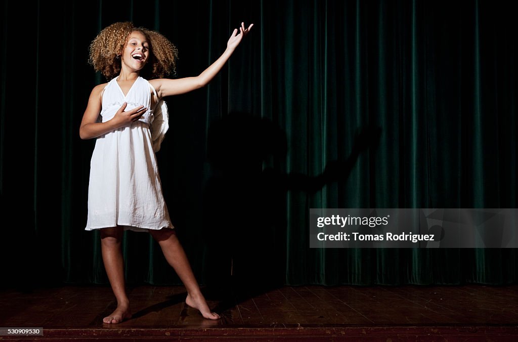Girl singing on stage
