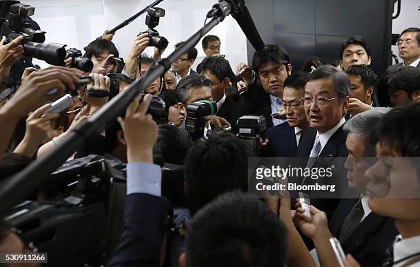 Kozo Takahashi, president of Sharp Corp., right, speaks to the media following a news conference in Tokyo, Japan, on Thursday, May 12, 2016. Sharp...