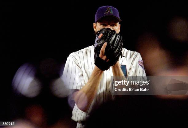 Starting pitcher Randy Johnson of the Arizona Diamondbacks prepares to throw against the Atlanta Braves during the first inning of the National...