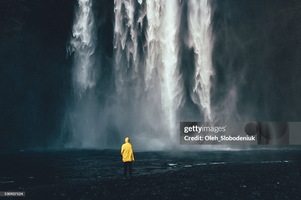 Man near the waterfall