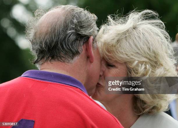 Prince Charles wins a prize and a kiss from his wife Camilla the Duchess of Cornwall after polo at Cirencester on June 17, 2005 in Cirencester,...