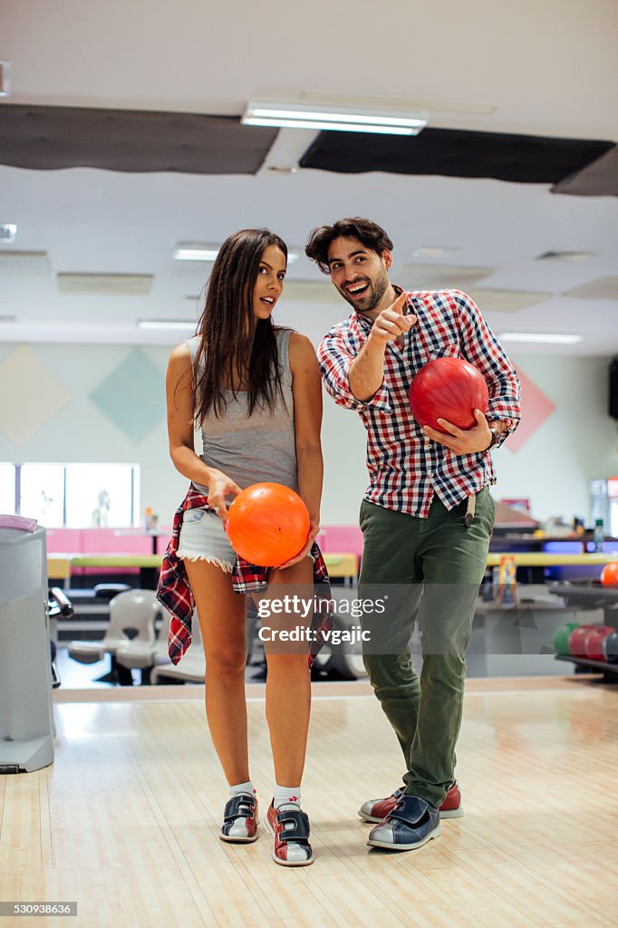 Cheerful Friends Bowling Together