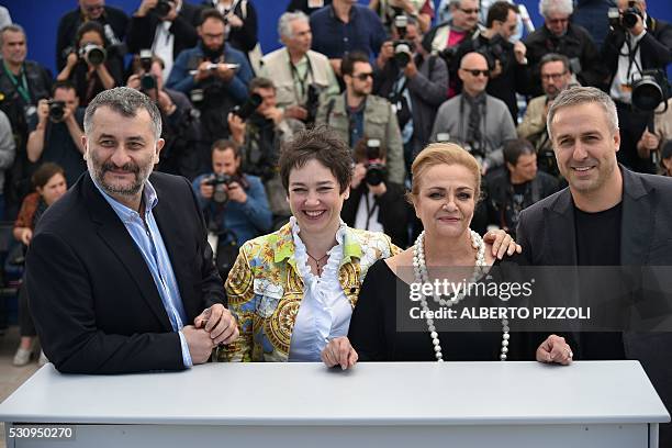 Romanian director Cristi Puiu poses on May 12, 2016 with Romanian producer Anca Puiu , Romanian actress Dana Dogaru and Romanian actor Mimi Branescu...