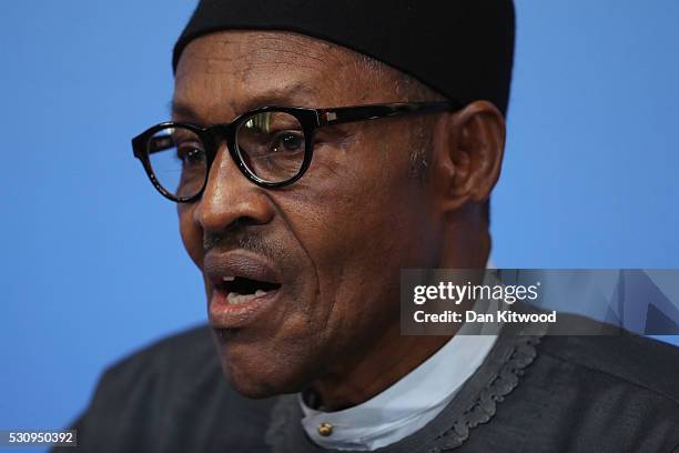 Nigerian President Muhammadu Buhari speaks after British Prime Minister Cameron opened the international anti-corruption summit on May 12, 2016 in...