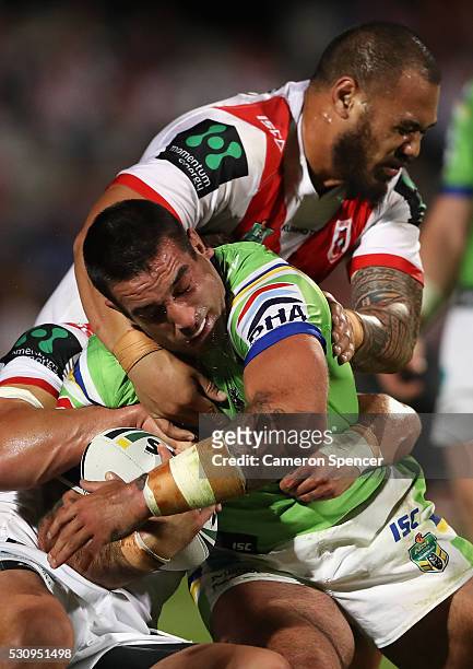 Paul Vaughan of the Raiders is tackled during the round 10 NRL match between the St George Illawarra Dragons and the Canberra Raiders on May 12, 2016...