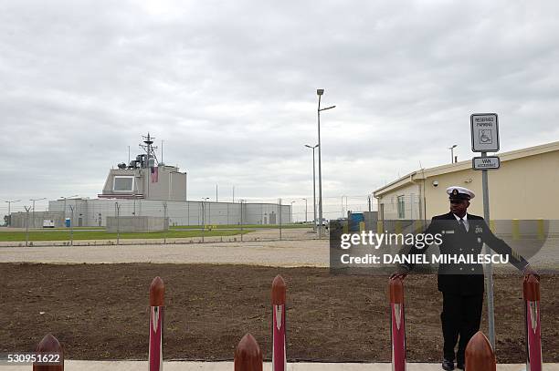 Army personnel stands at the red carpet ahead an inauguration ceremony of the US anti-missile station Aegis Ashore Romania at the military base in...