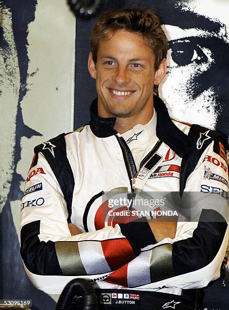 Honda F1 driver Jenson Button of Britain waits in his pit during the second practice for the Formula One United States Grand Prix, 17 June at the...