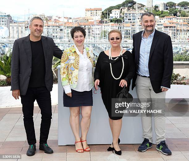 Romanian director Cristi Puiu poses on May 12, 2016 with Romanian actor Mimi Branescu, Romanian producer Anca Puiu and Romanian actress Dana Dogaru...