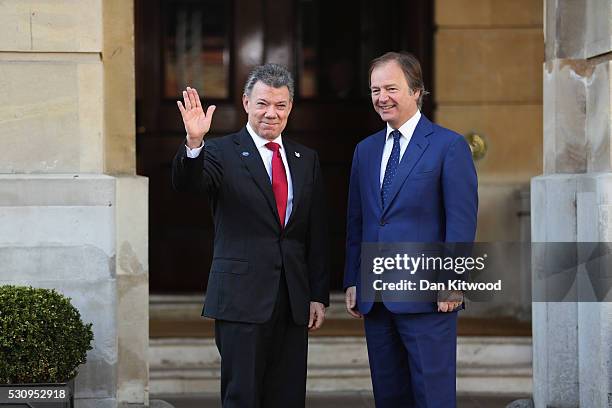 Foreign Office Minister Hugo Swire greets Colombian President Juan Manuel Santos, at Lancaster House for the international anti-corruption summit on...