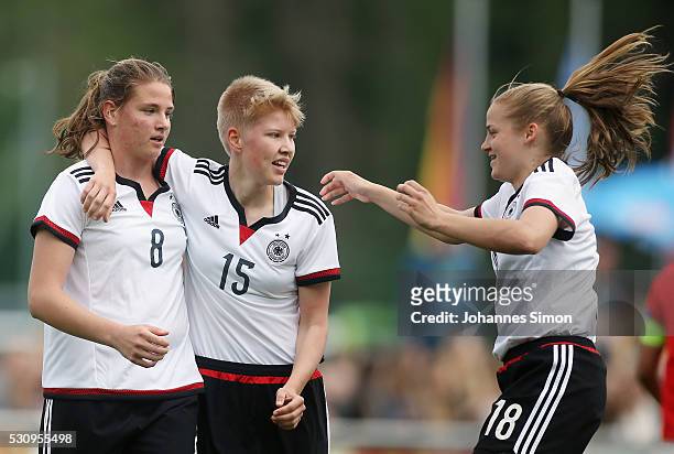 Lisa Ebert of Germany celebrates with team mates Paulina Krumbiegel and Lena Uebach after scoring her team's first goal during the U16 girl's...