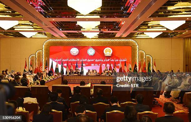 China's Foreign Minister Wang Yi , Qatar's Foreign Minister Sheikh Mohammed bin Abdulrahman al-Thani and Arab League Secretary General Nabil al-Arabi...