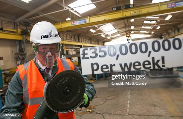 Boris Johnson is shown how to use a angle grinder as he visits Reidsteel, a Christchurch company backing the Leave Vote on the 23rd June 2016. On May...