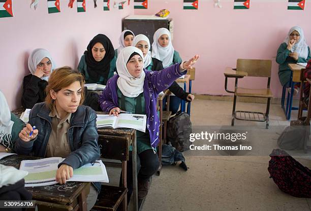 Amman, Jordan Teaching at the school bilayer Al Quds , Amman. There Jordanian and Syrian children are taught in separate layers on April 03, 2016 in...