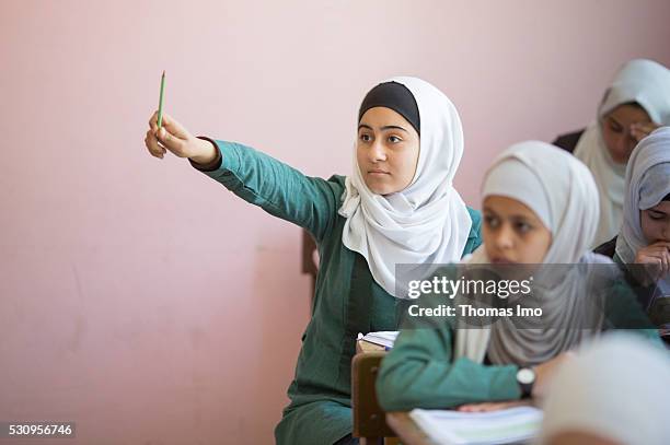 Amman, Jordan Teaching at the school bilayer Al Quds , Amman. There Jordanian and Syrian children are taught in separate layers on April 03, 2016 in...