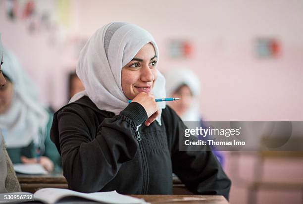 Amman, Jordan Teaching at the school bilayer Al Quds , Amman. There Jordanian and Syrian children are taught in separate layers on April 03, 2016 in...