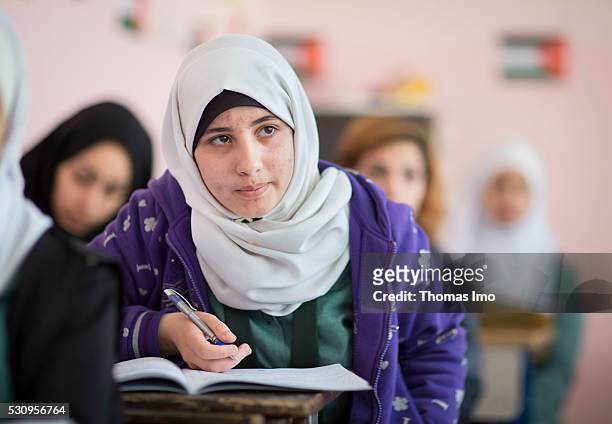 Amman, Jordan Teaching at the school bilayer Al Quds , Amman. There Jordanian and Syrian children are taught in separate layers on April 03, 2016 in...