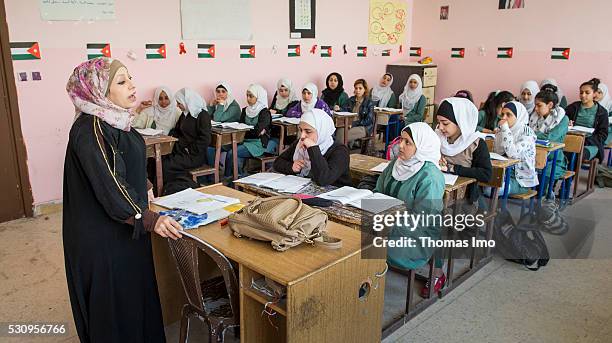 Amman, Jordan Teaching at the school bilayer Al Quds , Amman. There Jordanian and Syrian children are taught in separate layers on April 03, 2016 in...