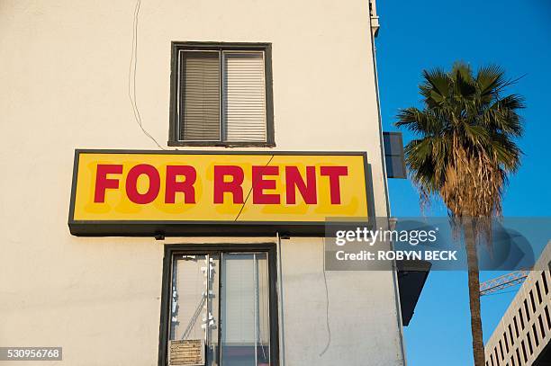For Rent" sign is seen on a building Hollywood, California, May 11, 2016. Angelinos are feeling the increasing burden of rising rents and threats of...