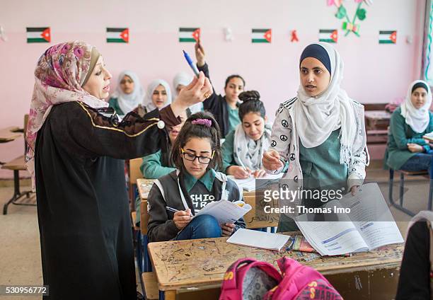 Amman, Jordan Teaching at the school bilayer Al Quds , Amman. There Jordanian and Syrian children are taught in separate layers on April 03, 2016 in...