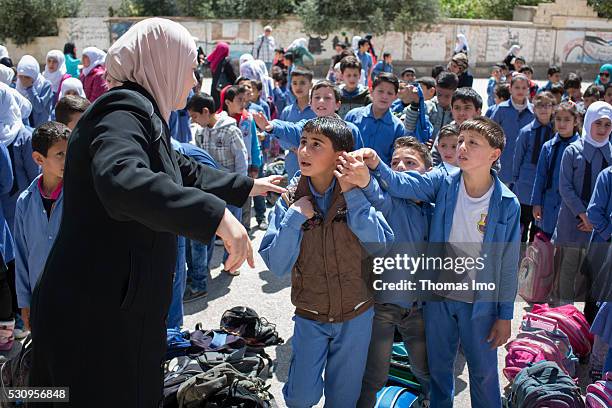 Amman, Jordan Teaching at the school bilayer Al Quds , Amman. There Jordanian and Syrian children are taught in separate layers on April 03, 2016 in...