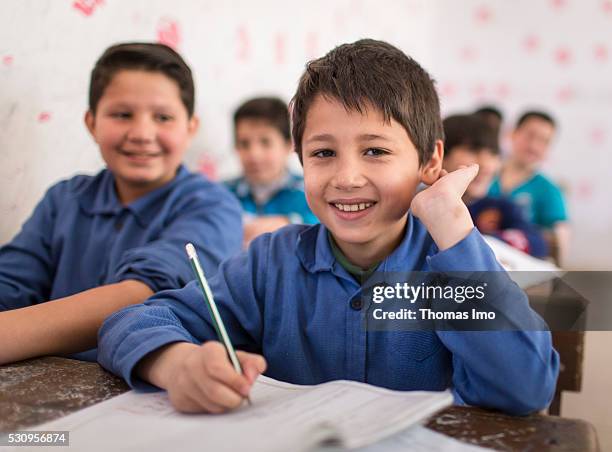 Amman, Jordan Teaching at the school bilayer Al Quds , Amman. There Jordanian and Syrian children are taught in separate layers on April 03, 2016 in...