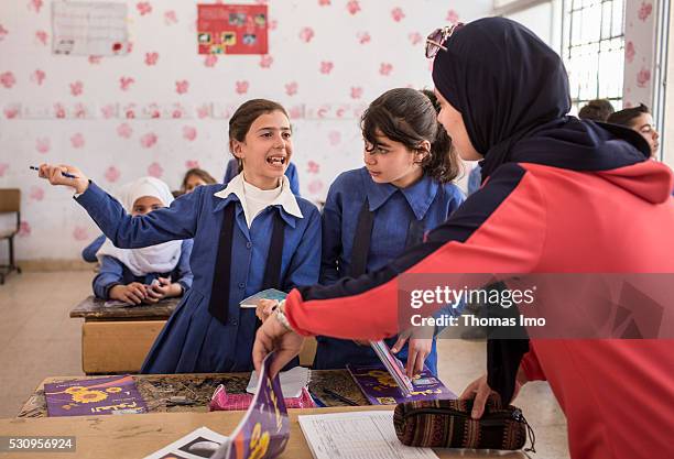 Amman, Jordan Teaching at the school bilayer Al Quds , Amman. There Jordanian and Syrian children are taught in separate layers on April 03, 2016 in...