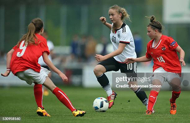 Andrea Brunner of Germany fights for the ball with Lisa Kolb and Maria Plattner of Austria during the U16 girl's international friendly between U16...