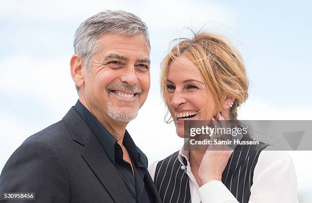 George Clooney and Julia Roberts attend the "Money Monster" Photocall at the annual 69th Cannes Film Festival at Palais des Festivals on May 12, 2016...