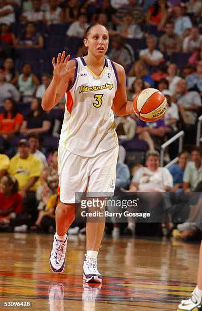 Diana Taurasi of the Phoenix Mercury moves the ball against the Seattle Storm during the WNBA game on June 2, 2005 at America West Arena in Phoenix,...
