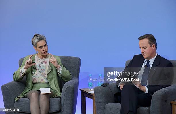 Sarah Chayes from the Carnegie Endownment for International Peace and British Prime Minister David Cameron during a panel discussion at the...