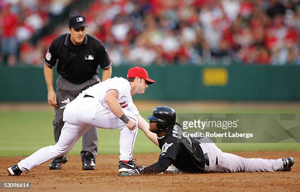 Second baseman Luis Castillo of the Florida Marlins is safe at second base as Adam Kennedy of the Los Angeles Angels of Anaheim tries to tag him on...
