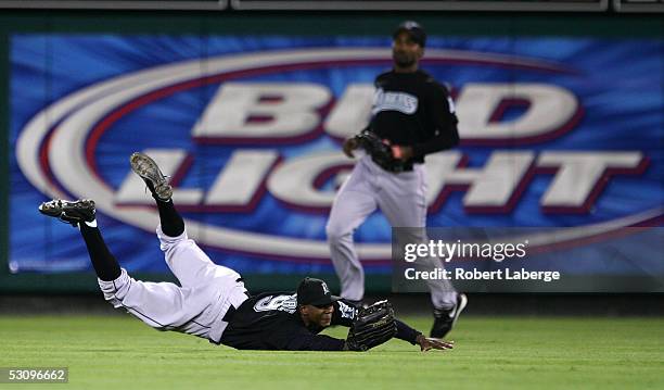 Center Juan Pierre of the Florida Marlins makes a catch on a ball hit by Mike Powell of the Los Angeles Angels of Anaheim in the fifth inning on June...